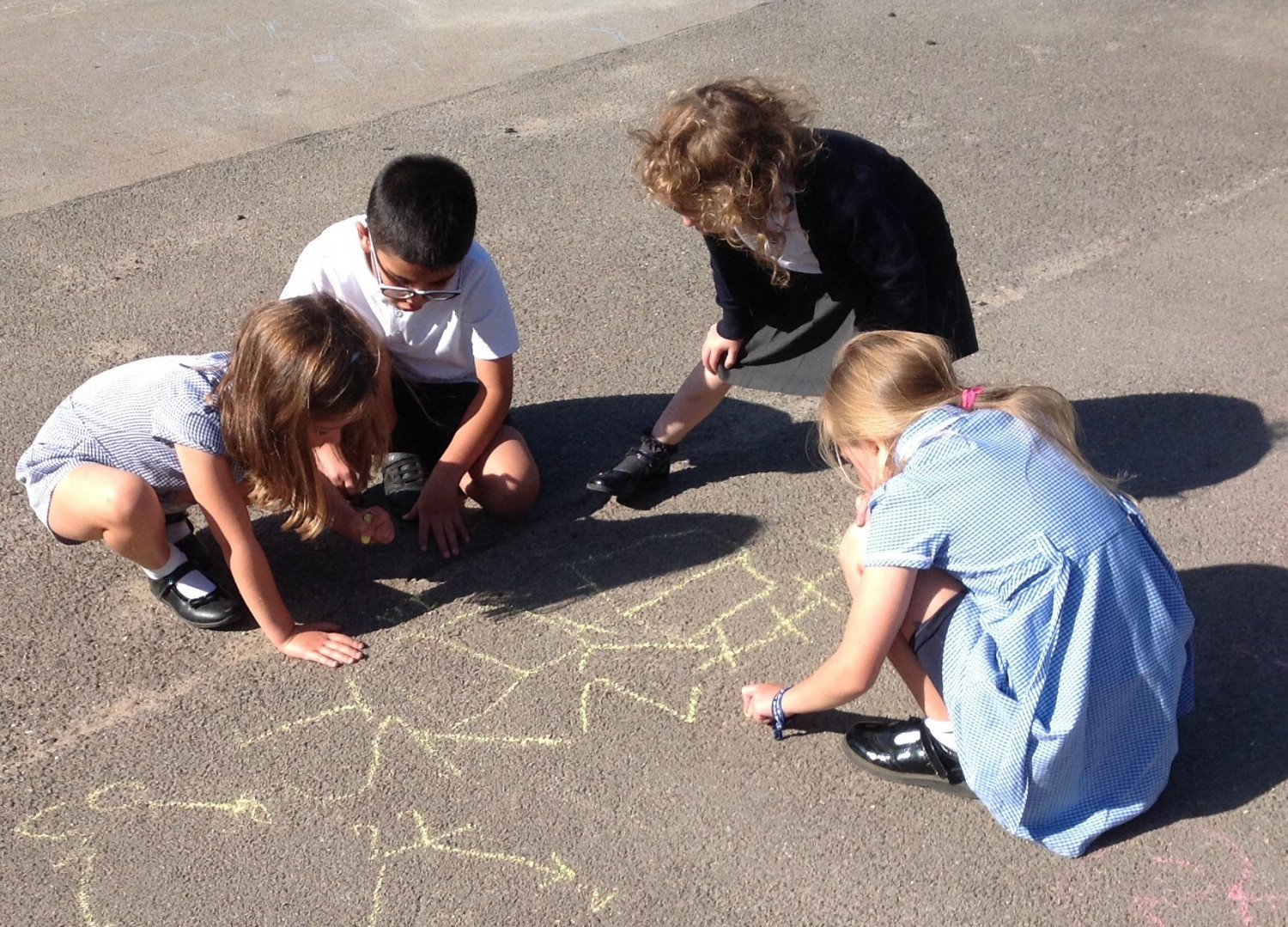 children working on puzzle on playground