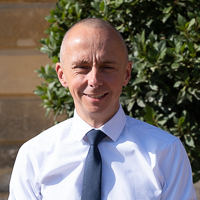 Headshot of Christian McGuiness